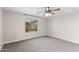 Neutral bedroom features a ceiling fan and a view from a window at 322 N 78Th Pl, Mesa, AZ 85207