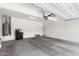 Spacious two-car garage with ample lighting, a water heater, and a water filtration system at 322 N 78Th Pl, Mesa, AZ 85207