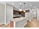 Modern kitchen featuring granite counters, stainless appliances, and a spacious island at 322 N 78Th Pl, Mesa, AZ 85207