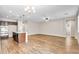 Open-concept kitchen and living area with hardwood floors and ample space for entertaining at 322 N 78Th Pl, Mesa, AZ 85207