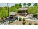 Community playground with shaded seating area and play equipment at 322 N 78Th Pl, Mesa, AZ 85207