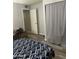 Bedroom featuring wood-look floors and closet at 3229 W Cholla St, Phoenix, AZ 85029