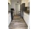 Updated kitchen with stainless appliances, modern white cabinetry, granite countertops and updated vinyl floors at 3229 W Cholla St, Phoenix, AZ 85029