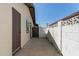 Enclosed backyard with block wall for privacy, with side door and plenty of room for a yard at 3719 W Griswold Rd, Phoenix, AZ 85051