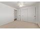 Large bedroom with a ceiling fan and double closets for organized storage solutions at 3719 W Griswold Rd, Phoenix, AZ 85051