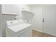 Convenient laundry room equipped with modern appliances, storage cabinets and exterior access at 3719 W Griswold Rd, Phoenix, AZ 85051