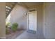 Inviting front door with welcome mat and fresh landscaping, providing a warm entrance to the home at 3830 E Lakewood Pkwy # 1057, Phoenix, AZ 85048