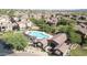 Aerial view of community pool and lounge area, surrounded by lush landscaping at 3935 E Rough Rider Rd # 1039, Phoenix, AZ 85050