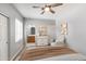Relaxing bedroom featuring a cozy seating area, a view of the en suite bathroom, and lots of natural light at 3935 E Rough Rider Rd # 1039, Phoenix, AZ 85050