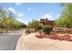 Exterior shot of the community entrance, showing landscaping and the building's address at 3935 E Rough Rider Rd # 1039, Phoenix, AZ 85050