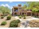 Multi-level home with desert landscaping, private balconies and stucco facade at 3935 E Rough Rider Rd # 1039, Phoenix, AZ 85050