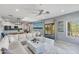 Open-concept living room with large sectional couch and access to a balcony at 3935 E Rough Rider Rd # 1039, Phoenix, AZ 85050