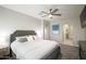 Primary bedroom with a stylish upholstered bed and arched doorway leading to the bathroom at 3935 E Rough Rider Rd # 1039, Phoenix, AZ 85050