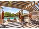 Community pool area with comfortable seating under a shaded pergola at 3935 E Rough Rider Rd # 1039, Phoenix, AZ 85050