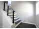 Modern staircase features wooden treads and an industrial style metal railing at 3935 E Rough Rider Rd # 1039, Phoenix, AZ 85050