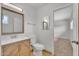 Bathroom featuring modern vanity with white marble countertop and a framed mirror at 4102 W Golden Ln, Phoenix, AZ 85051