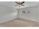 Neutral bedroom with carpet, ceiling fan, and a window providing outdoor light at 4102 W Golden Ln, Phoenix, AZ 85051