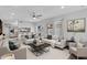 Open living area with contemporary decor, light hardwood floors, and abundant natural light creates an inviting space at 4102 W Golden Ln, Phoenix, AZ 85051