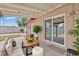 Comfortable covered patio featuring stylish seating, perfect for enjoying outdoor living and dining at 4102 W Golden Ln, Phoenix, AZ 85051