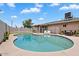Inviting backyard pool with a lounge area, perfect for outdoor relaxation and entertaining on sunny days at 4102 W Golden Ln, Phoenix, AZ 85051