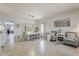 Open-concept dining room featuring tile floors, modern lighting, and stylish decor and neutral colors at 43319 W Oakland Ct, Maricopa, AZ 85138