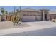Charming single-story home featuring desert landscaping, neutral paint, and a three-car garage at 43319 W Oakland Ct, Maricopa, AZ 85138
