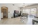 Open-concept living area with access to patio and abundant natural light at 43319 W Oakland Ct, Maricopa, AZ 85138