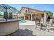 Beautiful backyard boasts a pool, a built-in bar, and patio seating at 4353 W Walton Way, Chandler, AZ 85226
