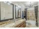 Bathroom featuring double vanity, granite countertops, and decorative shower curtain at 4353 W Walton Way, Chandler, AZ 85226