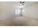 Spacious bedroom with neutral carpet, vaulted ceilings and white shutters on the window at 4353 W Walton Way, Chandler, AZ 85226