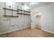 Bedroom with wood look flooring, neutral walls, shelves, and open closet at 4353 W Walton Way, Chandler, AZ 85226