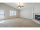 Bedroom featuring fireplace and shutters with access to the patio at 4353 W Walton Way, Chandler, AZ 85226