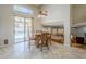Open dining area with view of the backyard pool and access to a cozy living space at 4353 W Walton Way, Chandler, AZ 85226