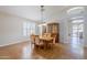 Dining area with wood floors, designer lighting fixture, shuttered windows, and built-in hutch at 4353 W Walton Way, Chandler, AZ 85226