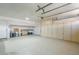 Spacious three-car garage with ample storage and cabinets at 4353 W Walton Way, Chandler, AZ 85226