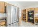 Bright kitchen featuring stainless steel appliances, oak cabinetry and spacious pantry with pull-out shelving at 4353 W Walton Way, Chandler, AZ 85226
