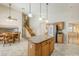 Bright kitchen featuring granite island seating, stainless appliances, and open layout to dining area at 4353 W Walton Way, Chandler, AZ 85226