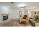 Cozy Gathering room showcasing a fireplace, plush seating, and an open layout to other living spaces at 4353 W Walton Way, Chandler, AZ 85226