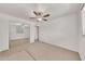 Bedroom with mirrored closet, carpeting, ceiling fan, and natural light at 4599 N 17Th Ave, Phoenix, AZ 85015