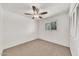 Cozy bedroom features neutral carpet, window, and built-in closet at 4599 N 17Th Ave, Phoenix, AZ 85015