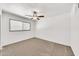 Comfortable bedroom featuring plush carpeting and a ceiling fan at 4599 N 17Th Ave, Phoenix, AZ 85015