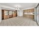 Open dining area featuring tile floors, a stylish chandelier, and functional built-in storage at 4599 N 17Th Ave, Phoenix, AZ 85015