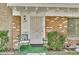 Charming home featuring a brick facade and secure front door with decorative metalwork at 4599 N 17Th Ave, Phoenix, AZ 85015
