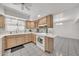 Bright kitchen with oak cabinetry and adjacent dining area; appliances included at 4599 N 17Th Ave, Phoenix, AZ 85015