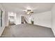 Spacious living room featuring a ceiling fan and staircase to the upper level at 4599 N 17Th Ave, Phoenix, AZ 85015