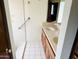 Bathroom features a dual-sink vanity and a tiled shower for modern comfort at 4727 E Euclid Ave, Phoenix, AZ 85044