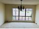 Living room with a large window providing outdoor view and natural lighting at 4727 E Euclid Ave, Phoenix, AZ 85044