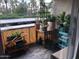 Charming balcony adorned with potted plants and a trellis, creating a serene outdoor space at 4727 E Lafayette Blvd # 211, Phoenix, AZ 85018