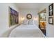 Cozy bedroom with a serene atmosphere, featuring soft lighting, decor, and a view of the balcony at 4727 E Lafayette Blvd # 211, Phoenix, AZ 85018
