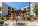 Villa Layfette community entrance with manicured landscaping and a covered walkway at 4727 E Lafayette Blvd # 211, Phoenix, AZ 85018